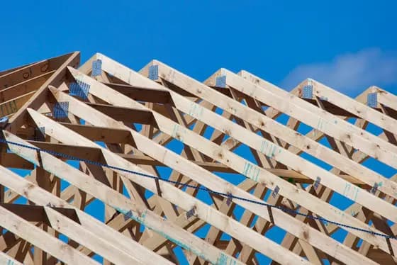 Roof trusses erected over a house under construction