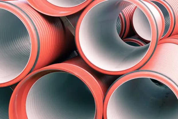 Stacked plastic plumbing pipes